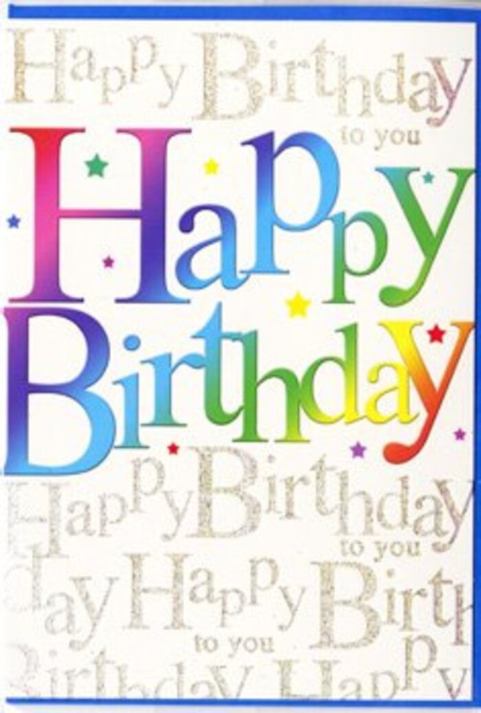 The photograph captures a contemporary birthday card whose front radiates warmth and celebration, reminiscent of the lively, creative spirit around Kings Cross. At the heart of the design, the phrase Happy Birthday is printed in bold, inviting letters that stretch generously across the card, each one filled with a silky gradient of colour. The hues flow effortlessly from velvety red through rich orange and gold, then soften into lime green, turquoise, and deep blue, creating an effect similar to looking at a well-balanced bouquet of mixed seasonal flowers, each shade supporting the next. These rainbow letters sit against a gently tinted, off-white background, which is adorned with fine, repeating lines of gold script. In elegant, cursive handwriting, the words Happy Birthday to you appear again and again, forming a shimmering backdrop that glints with a subtle metallic sheen, like evening light catching the brickwork and glass around King's Boulevard. The gold script feels delicate and slightly raised, suggesting an almost tactile quality, even though the card's surface looks smooth and refined. Between the letters and around the edges, faint flecks and tiny stars in coordinating colours give the impression of scattered party confetti, adding a sense of movement and fun without cluttering the composition. The balance between vivid colour and intricate gold detail makes the card feel both youthful and thoughtfully designed, an ideal companion to a vibrant birthday bouquet delivered near York Way or a cosy home just off Euston Road. It is a card that not only conveys birthday wishes but also captures the feeling of a joyful celebration shared with people who matter.