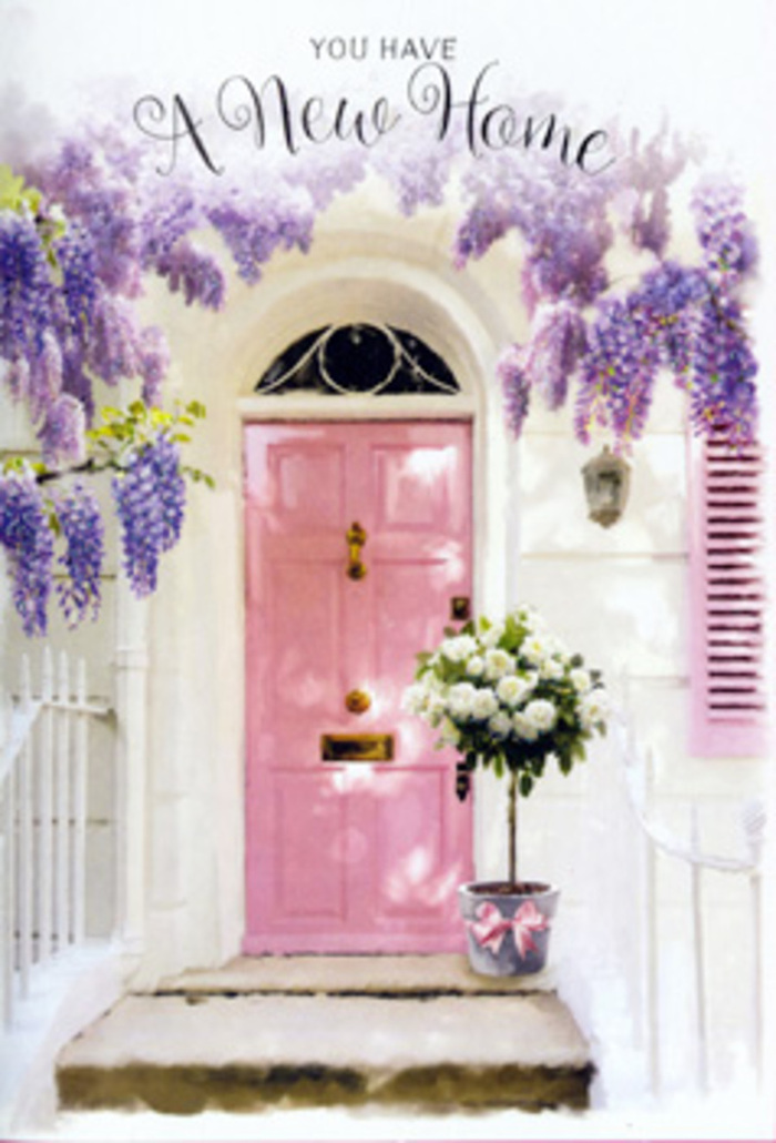 Outside a likely Victorian home near Kings Cross, a delicately painted pink door stands as a beacon of warmth beneath a generous sweep of lavender wisteria. The wisteria cascades from above in loose, grape-like clusters, its blossoms forming a textured curtain that softens the outlines of the doorway and lends an air of romantic calm, similar to the secret corners you might discover along the quieter streets near Regent's Canal. The walls around the door are freshly whitewashed, catching the light and making the pastel tones of the door appear even more inviting. At the doorstep sits a simple yet stylish grey bucket, brimming with hand-arranged white and cream roses. Each bloom is full and well-formed, their petals layered densely so that they almost spill over the edge of the container. Slender green stems and foliage weave between the roses, giving hints of movement and life, while a satin ribbon in a soft, rosy pink encircles the bucket's base, tied into a neat bow that feels deliberately placed. The stone threshold is gently worn, its surface smoothed by time, grounding the image in everyday London reality. Light filters through the wisteria's leaves, creating patterns of dappled shade that drift across the door and step, suggesting a calm, mild afternoon. This is the sort of welcoming scene a local florist at Flowers Kings Cross might create for same-day delivery to celebrate a client's move into a new flat near St Pancras or just off Pentonville Road. Together, the pastel door, cascading blooms, and lush roses whisper a message of welcome, hope, and the sweet anticipation of life unfolding in a new home.